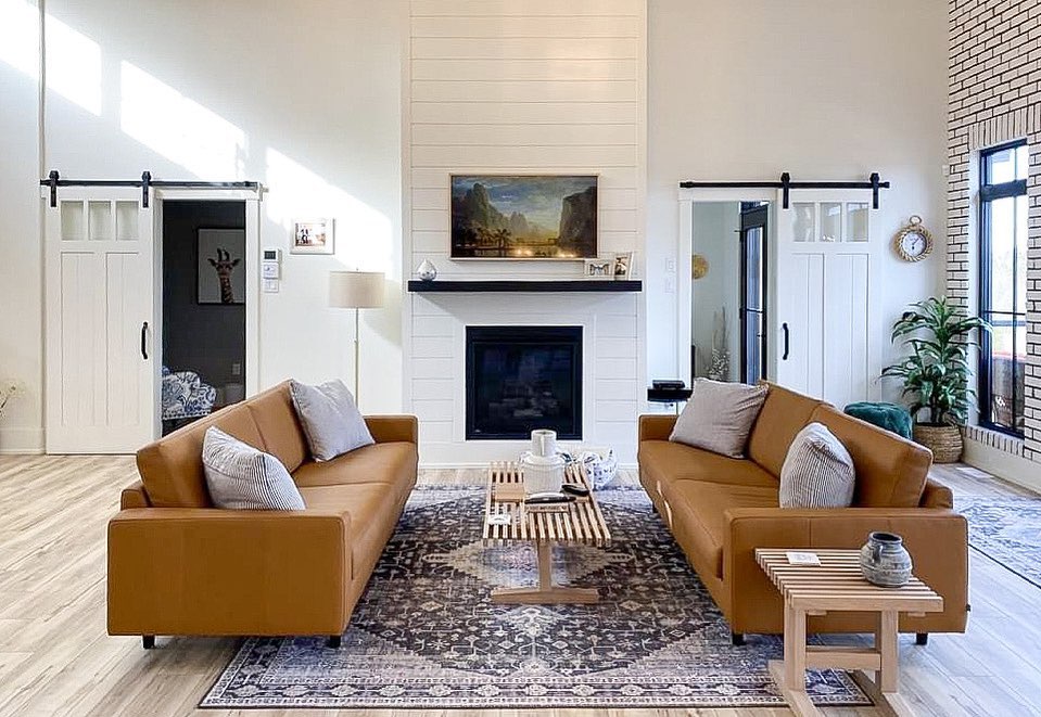 Vintage inspired rug in living room with white fireplace