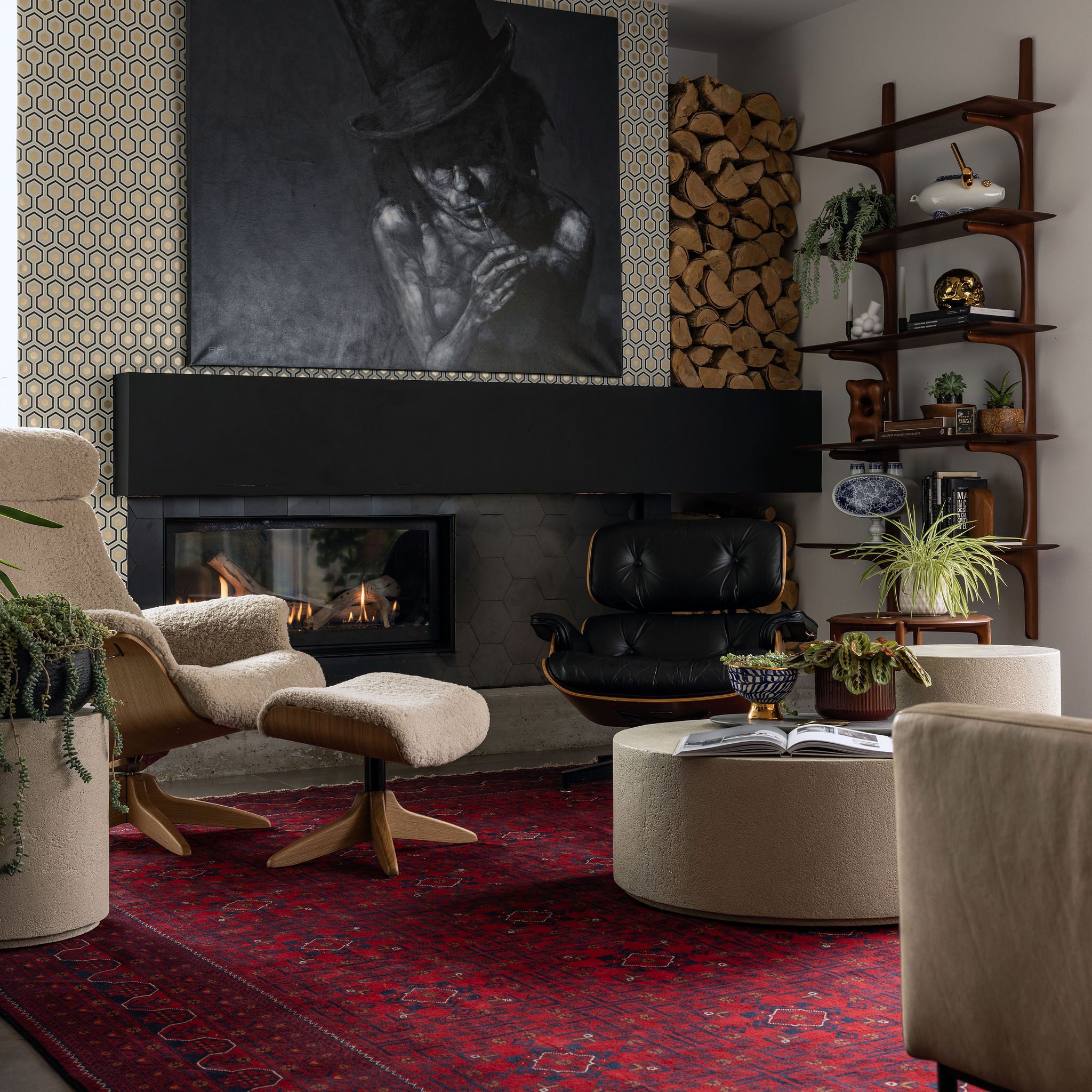 TUCKRUGS-2 Living room with large black portrait painting and red vintage carpet.